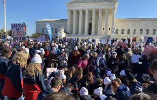 Students from Liberty University pray in front of the U.S. Supreme Court during oral arguments in the Dobbs v. Jackson Women's Health Organization abortion case on Dec. 1, 2021. Katie Yoder/CNA