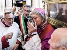 Naples Archbishop Domenico Battaglia kisses the reliquary containing the blood of St. Januarius on May 4, 2024.
