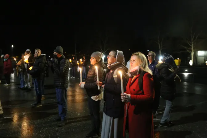 Pilgrims participate in a candlelight vigil at the Shrine of Our Lady of Lourdes in France