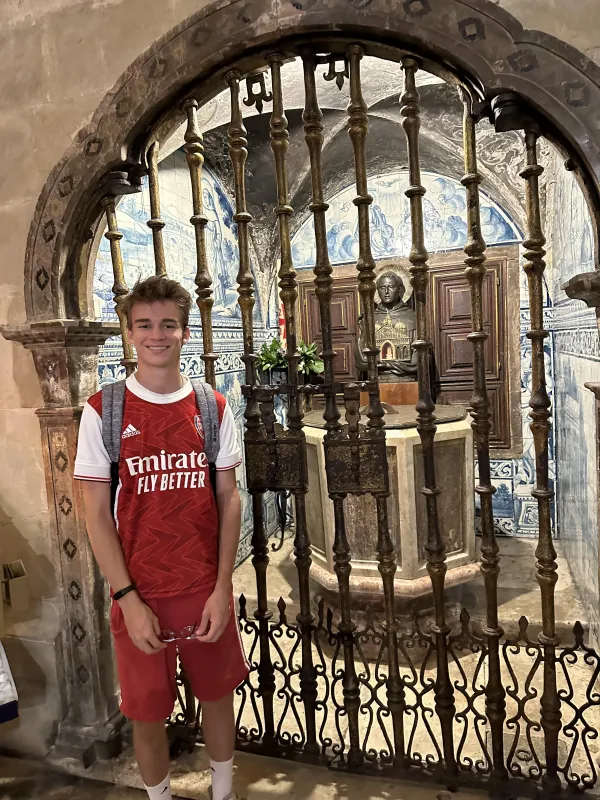 Anthony Love outside of the baptistery where St. Anthony of Padua was baptized, in Lisbon, Portugal, during WYD 2023. Photo credit: Alexis Love