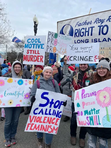 Young people pose with their signs outside the U.S. Supreme Court at the March for Life in Washington, D.C., on Jan. 21, 2022. Christine Rousselle/CNA
