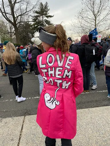 A woman sports a message on her coat outside the U.S. Supreme Court at the March for Life in Washington, D.C., on Jan. 21, 2022. Katie Yoder/CNA