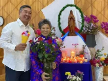Father Andrew Tin Nguyen, parish priest of Mary Help of Christians in Darkhan, Mongolia, with Tsetsegee, who found a statue of the Blessed Mother in a landfill, which will be blessed by Pope Francis during his trip to Mongolia from Aug. 31–Sept. 4, 2023.