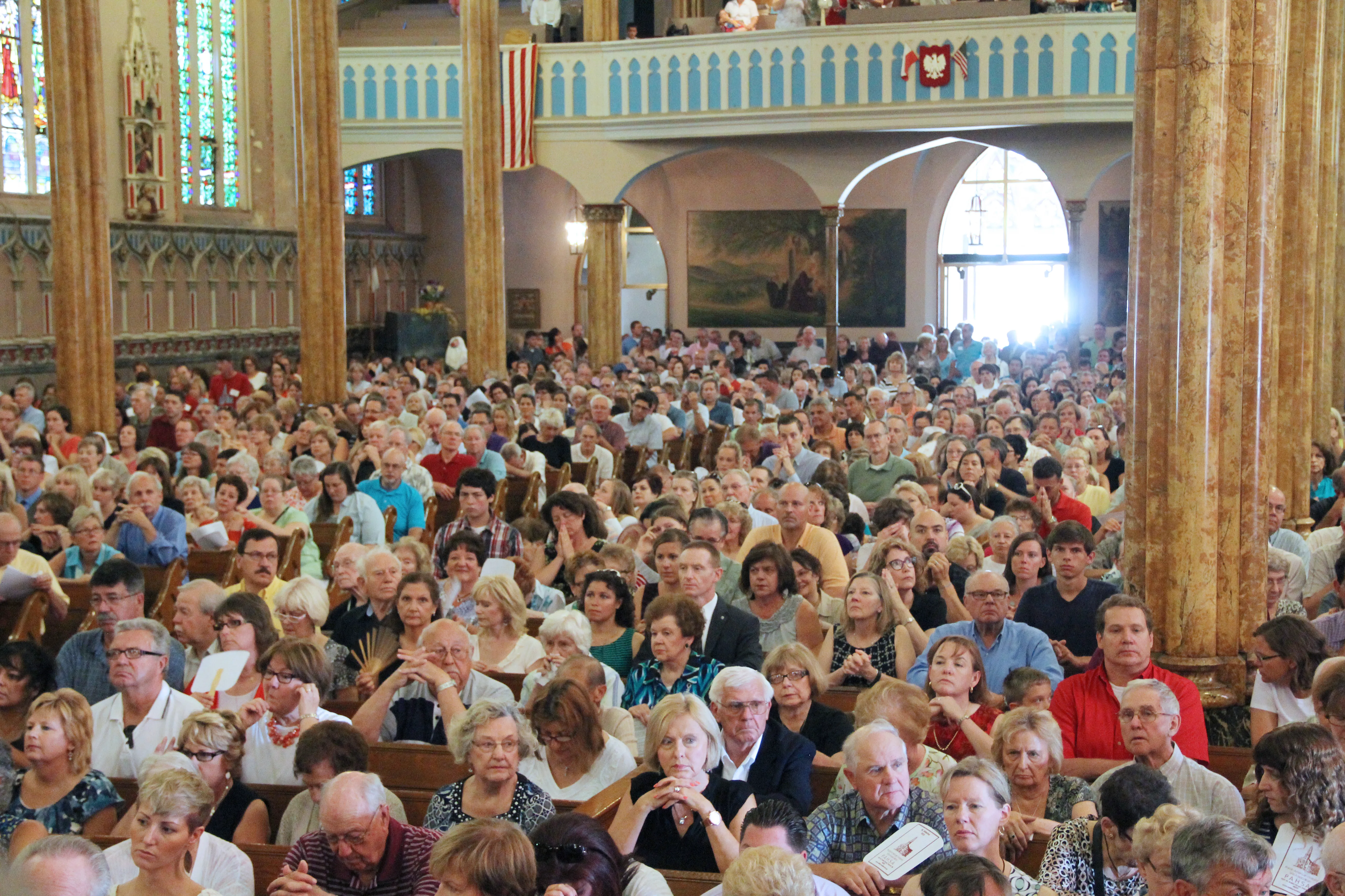 Massgoers fill St. Albertus Church in Detroit, Michigan, for Mass Mob V Aug. 10, 2014. The movement, which started in Buffalo in 2013 and quickly spread to other cities, found a lasting home in Detroit, which celebrated 51 events at historic city churches from 2014-19.?w=200&h=150