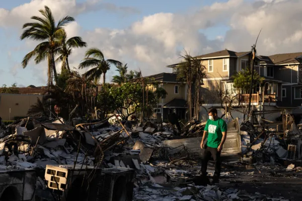 A Mercy Worldwide volunteer makes damage assessment of charred apartment complex in the aftermath of a wildfire in Lahaina, western Maui, Hawaii, on Aug. 12, 2023. Yuki Iwamura/AFP via Getty Images)