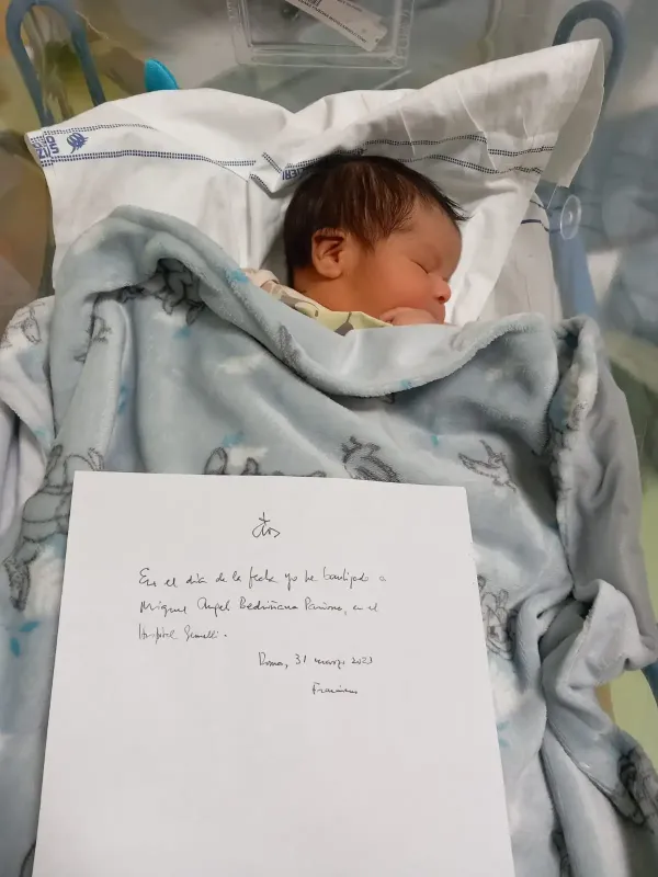 Baby Miguel Ángel and a handwritten note by Pope Francis that says: “On the day of the date (below) I baptized Miguel Angel Bedriñana Pariona, in Gemelli Hospital. Rome, 31 March 2023 Francesco.”. Credit: Vatican Media
