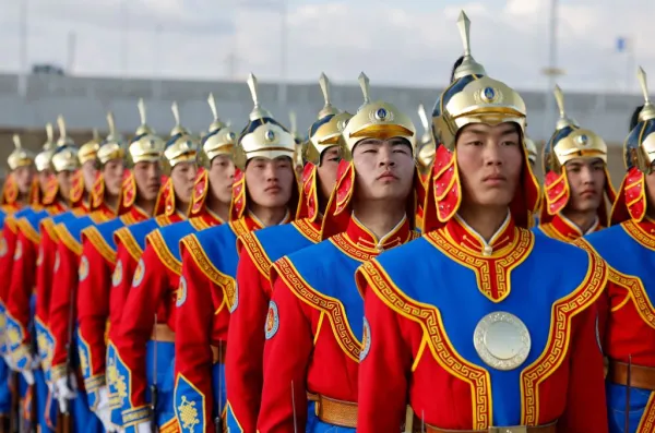 Members of the Mongolian guard of honor are seen at the Chinggis Khaan International Airport upon the arrival of France's president in Ulaanbaatar, the Mongolian capital, on May 21, 2023. Credit: Ludovic Marin/AFP via Getty Images