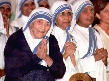 Mother Teresa (left) smiles during Mass at Sacred Heart Catholic Church in Atlanta, Georgia, on June 12, 1996.