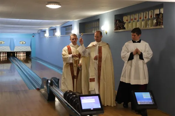 Monsignor Thomas Powers, rector of the Pontifical North American College, blesses the newly refurbished bowling lanes in the basement of the seminary on May 17, 2023. Credit: Pontifical North American College