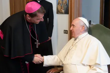 Pope Francis greets German Bishop Stefan Oster on May 2, 2022.