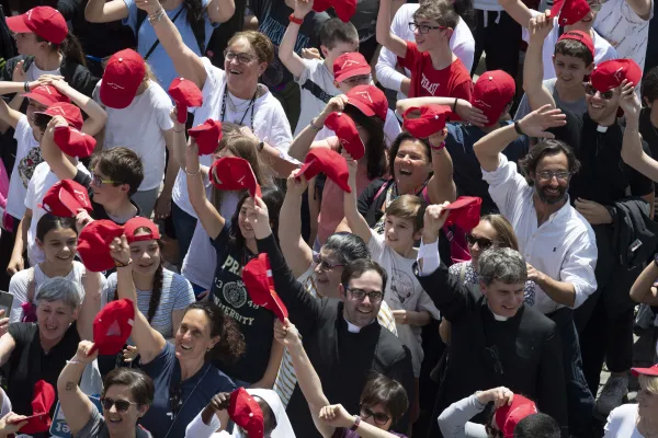 A large group of young people wearing red baseball caps from the Archdiocese of Genoa cheered loudly as the pope mentioned their visit to the Vatican. Vatican Media