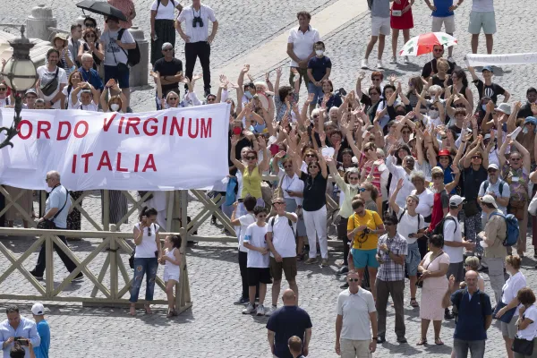 Pilgrims, including women who are consecrated virgins, wave during the Angelus Aug. 21, 2022. Pope Francis said: "I greet those consecrated women in the Ordo virginum, and I encourage them to witness to the joy of the love of Christ." Vatican Media.