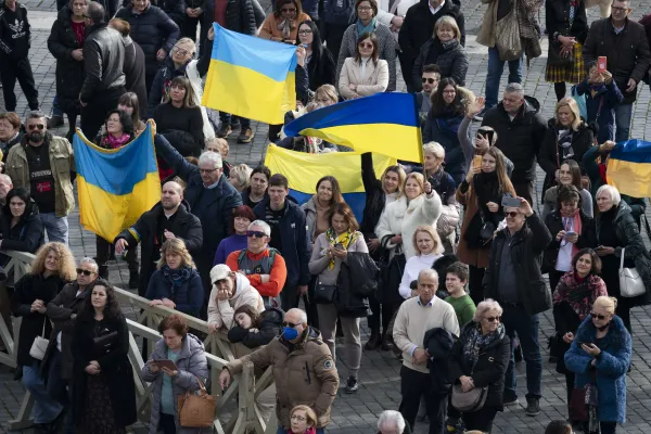 Ukrainian flags waved by visitors on St. Peter's Square, Dec. 26, 2022. Vatican Media