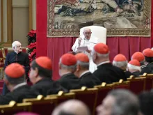 Pope Francis gives his annual Christmas address to the cardinals who work in Vatican offices on Dec. 21, 2023, in the gilded Hall of Benediction at the Vatican.