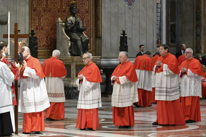 Cardinals venerate the Holy Cross during the Liturgy of the Lord's Passion on April 7, 2023.