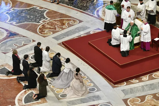 Pope Francis confers the lay ministry of catechist on nine people during Mass for the Sunday of the Word of God on Jan. 21, 2024.