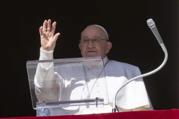 Pope Francis gives his Angelus address from the window of the Vatican's Apostolic Palace on Jan. 21, 2024.