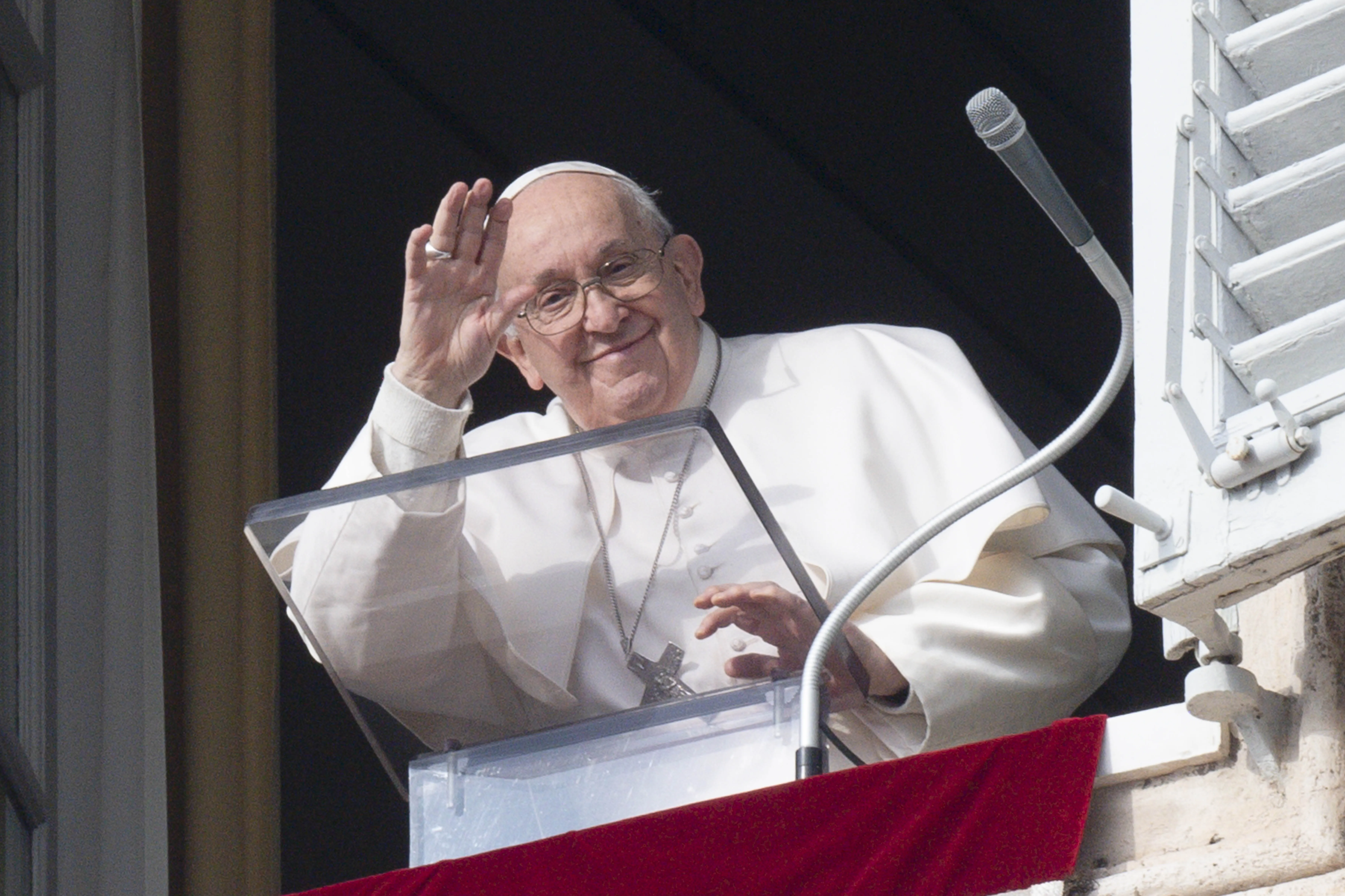 Pope Francis waves during his Sunday Angelus on Dec. 31, 2023.?w=200&h=150