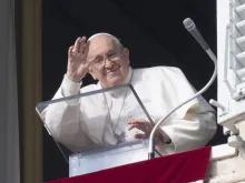 Pope Francis waves during his Sunday Angelus on Dec. 31, 2023.