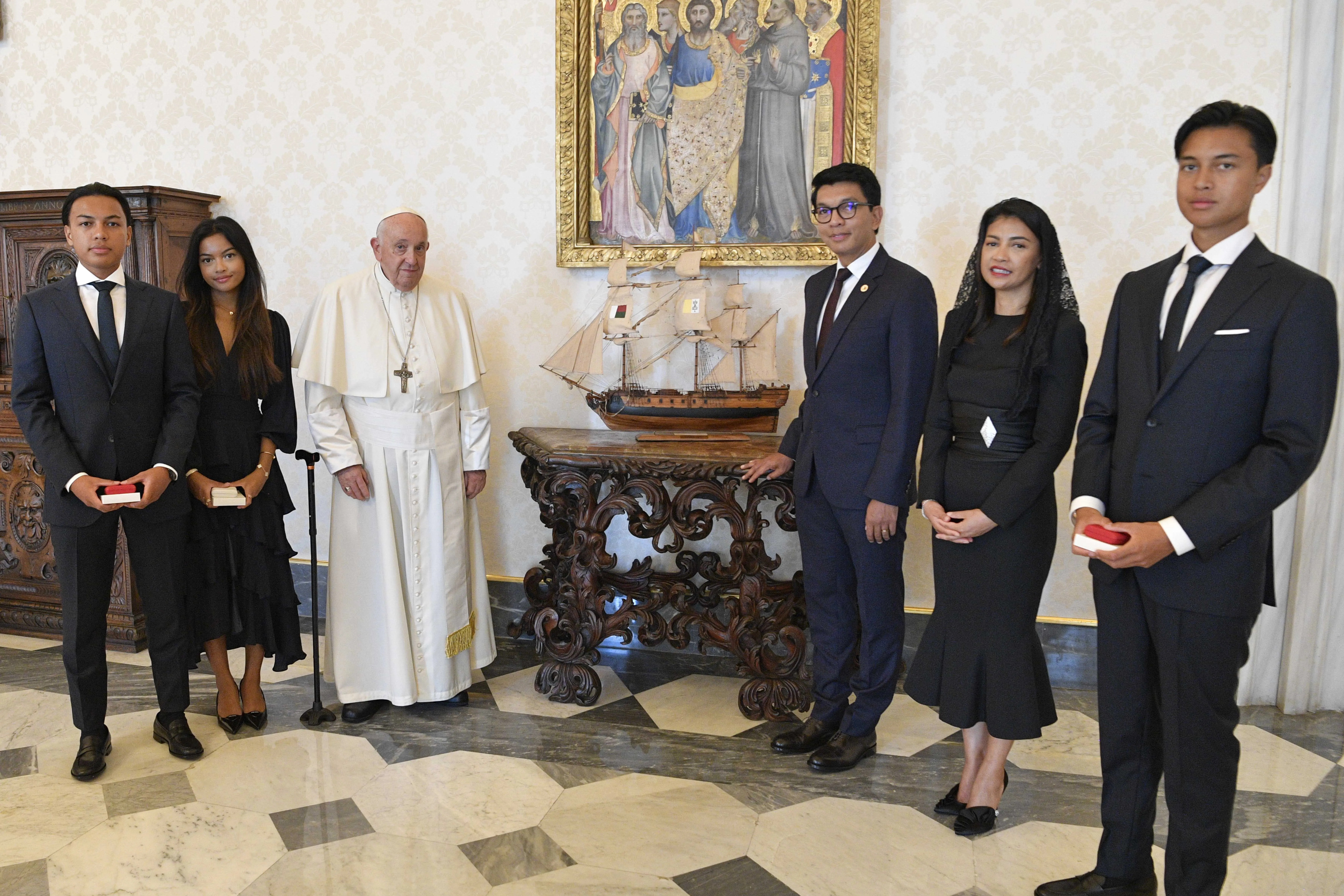 Pope Francis poses next to a miniature model of a ship with Madagascar's President Andry Nirina Rajoelina and his family in the Vatican's apostolic palace on Aug. 17, 2023.?w=200&h=150