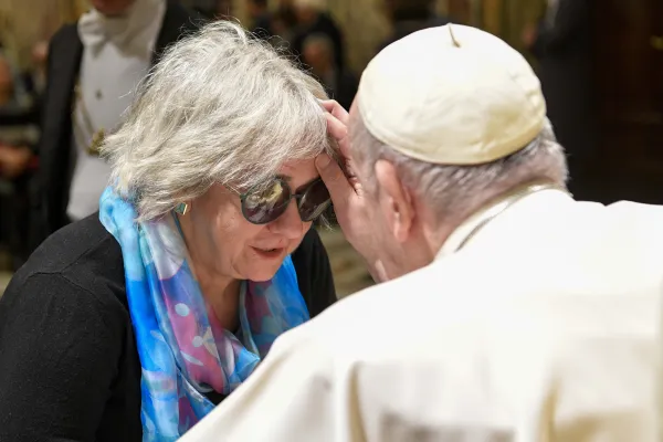 Special blessing: Pope Francis meeting with members of the Italian Union of the Blind and Visually Impaired at the Vatican, Dec. 12, 2022. Vatican Media