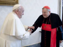 Pope Francis meets with Cardinal Raymond Burke on Dec. 29, 2023, at the Vatican.