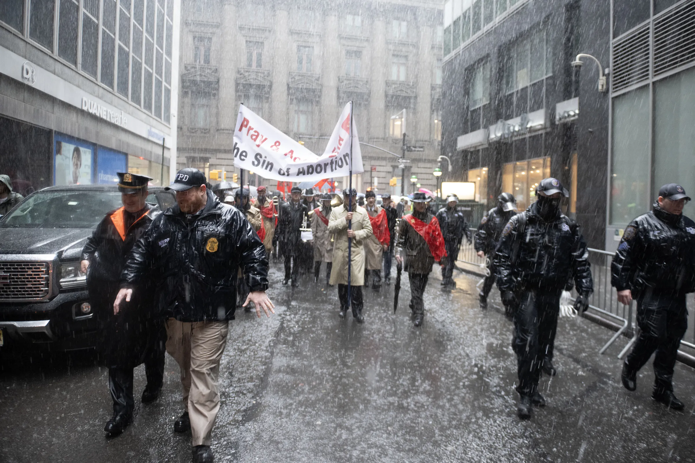 Pro-lifers march through lower Manhattan amid a heavy downpour and pro-abortion protests necessitating a significant police presence on March 23, 2024.?w=200&h=150