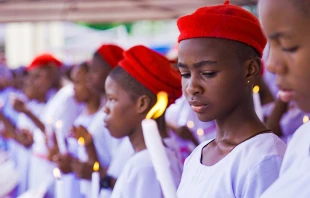 A group of school girls receiving the sacraments of baptism and confirmation in Onitsha, Anambra, Nigeria, on May 30, 2022. Shutterstock