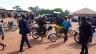 Police and residents of Wumat, a farming town 45 miles south of Jos, Nigeria, arrive to survey damage and help survivors of a terrorist attack on Nov 22, 2022.
