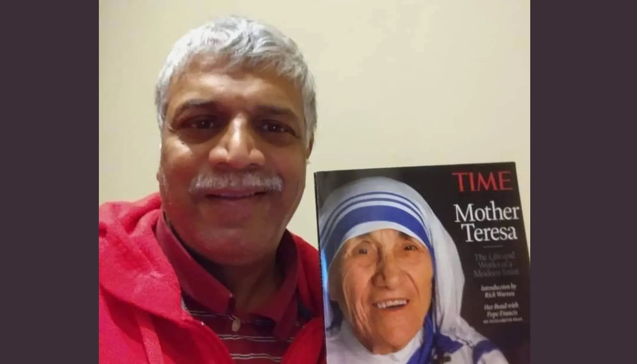 Patrick Norton pictured with a magazine cover of Mother Teresa, who picked him up from the streets of Bombay as an infant. Later he was adopted by an American family.?w=200&h=150