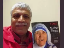 Patrick Norton pictured with a magazine cover of Mother Teresa, who picked him up from the streets of Bombay as an infant. Later he was adopted by an American family.