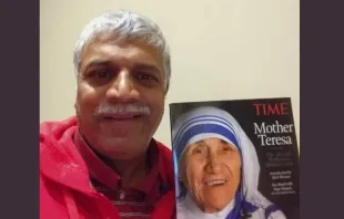 Patrick Norton pictured with a magazine cover of Mother Teresa, who picked him up from the streets of Bombay as an infant. Later he was adopted by an American family. Credit: Photo courtesy of Patrick Norton
