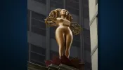 The golden-horned female statue titled “NOW” was made by Pakistani-born artist Shahzia Sikander.