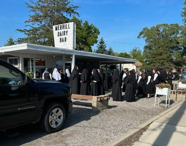 Dozens of Religious Sisters of Mercy of Alma, Michigan, stop at Merrill Whippy Dip in rural Michigan to celebrate a postulant member’s profession of vows for religious life with Bishop Robert D. Gruss of Saginaw, near Lake Huron, on Aug. 16, 2023.?w=200&h=150