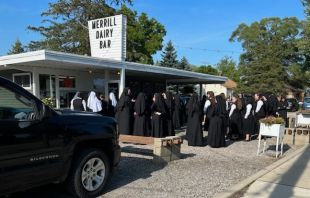 Dozens of Religious Sisters of Mercy of Alma, Michigan, stop at Merrill Whippy Dip in rural Michigan to celebrate a postulant member’s profession of vows for religious life with Bishop Robert D. Gruss of Saginaw, near Lake Huron, on Aug. 16, 2023. Photo courtesy of Rick Knapp