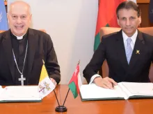 Archbishop Gabriele Caccia, Holy See Permanent Observer to the United Nations (left), and Mohammed Al-Hassan, Ambassador Extraordinary and Plenipotentiary of the Sultanate of Oman to the United Nations, at a signing ceremony establishing diplomatic relations between Oman and the Holy See. The ceremony took place  at the Permanent Mission of the Sultanate of Oman to the United Nations in New York City.
