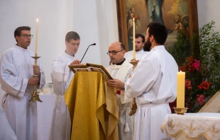 Father Gabriel Romanelli (center), the Latin parish priest of Gaza, is among the celebrants at a Mass to celebrate the feast day of Our Lady, Queen of Palestine and the Holy Land at the shrine dedicated to her at Deir Rafat on Sunday, Oct. 29, 2023. Credit: Marinella Bandini