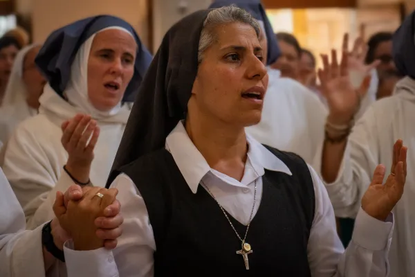 A nun prays the Our Father during a Mass in celebration of the feast day of Our Lady, Queen of Palestine and the Holy Land at the shrine dedicated to her at Deir Rafat on Sunday, Oct. 29, 2023. Credit: Marinella Bandini