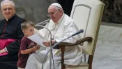 Pope Francis with a surprise visitor on stage at the General Audience in the Vatican on Aug. 17, 2022