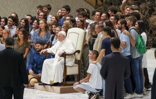 Pope Francis poses for a photo with a group of young people after his general audience Aug. 17, 2022. Pablo Esparza/CNA