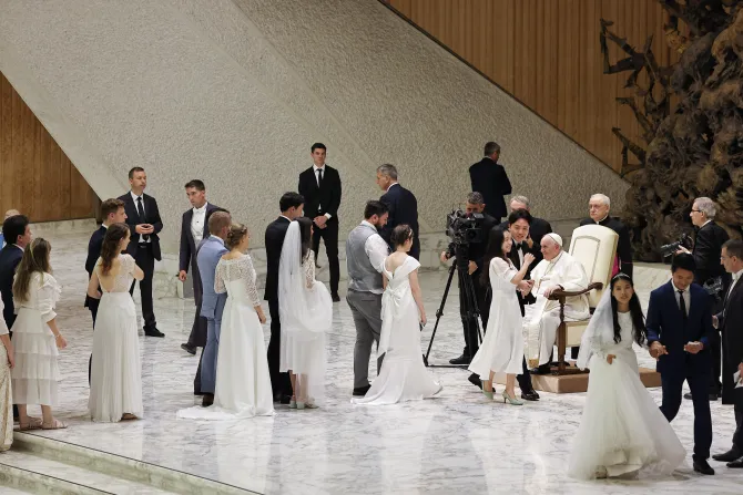 Pope Francis with newlywed couples at the Vatican on Aug. 24, 2022