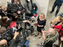 Päivi Räsänen, Finland’s interior minister from 2011 to 2015, speaks to reporters while holding her Bible at Helsinki District Court on Jan. 24, 2022.