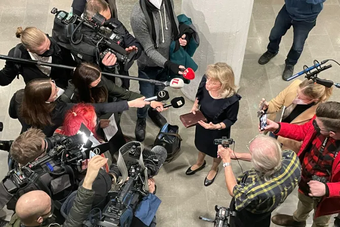 Päivi Räsänen, Finland’s interior minister from 2011 to 2015, speaks to reporters while holding her Bible at Helsinki District Court on Jan. 24, 2022