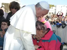 Pope Francis embraces Vinicio Riva after the general audience on Nov. 6, 2013.