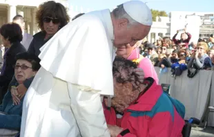 Pope Francis embraces Vinicio Riva after the general audience on Nov. 6, 2013. Credit: Vatican Media