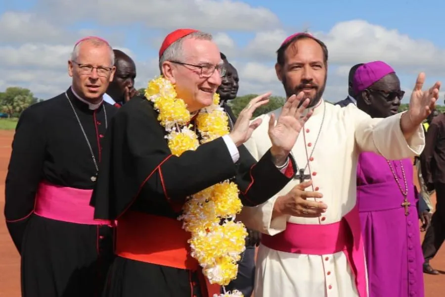 Cardinal Pietro Parolin (middle) and apostolic nuncio in Kenya and South Sudan, Archbishop Hubertus van Megen (left), are received in the Diocese of Rumbek by Bishop Christian Carlassare (right) on Aug. 17, 2023.?w=200&h=150
