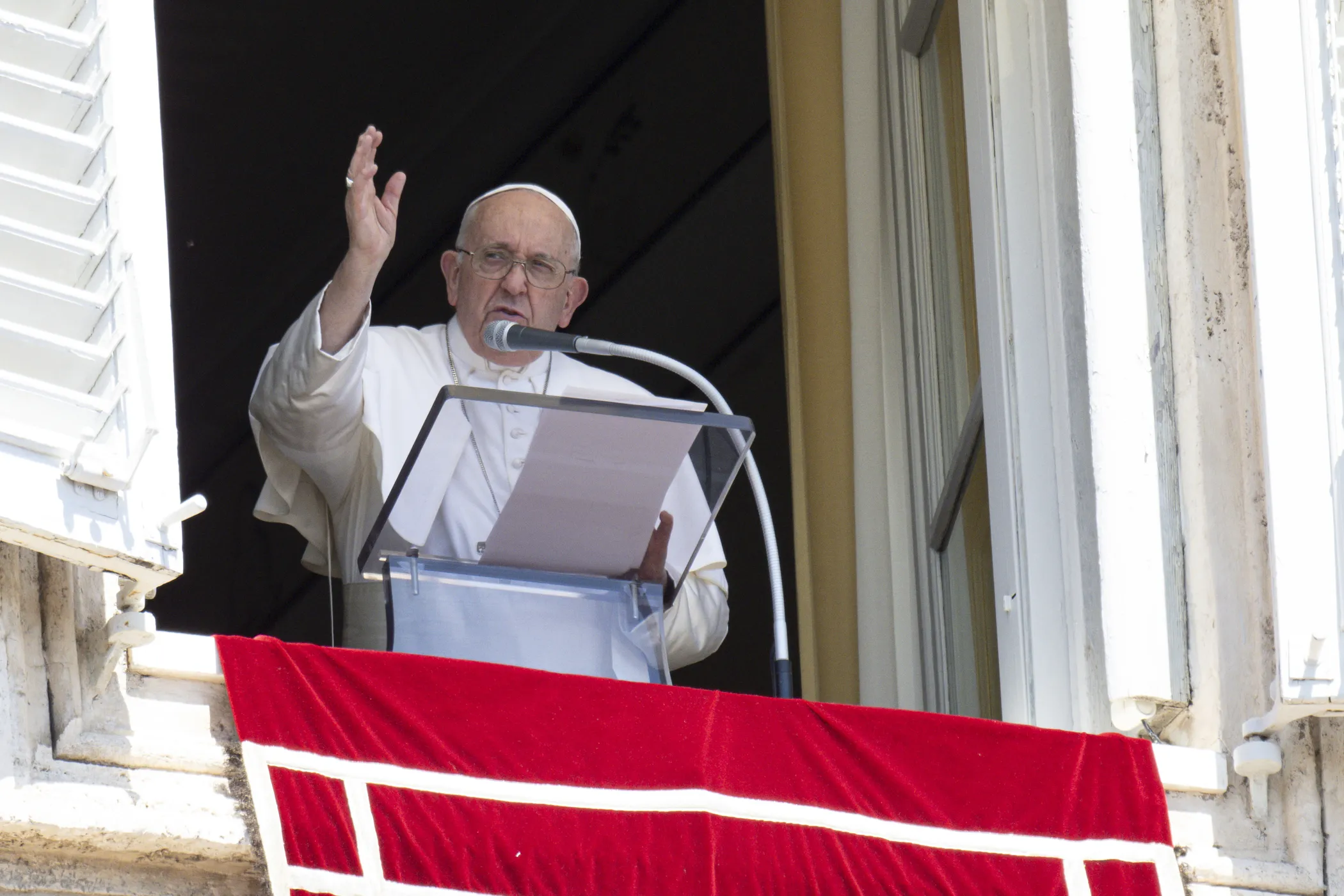Pope Francis blesses the crowd from a window overlooking St. Peter's Square at the end of his Sunday Angelus address Aug. 13, 2023.?w=200&h=150