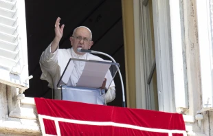 Pope Francis blesses the crowd from a window overlooking St. Peter's Square at the end of his Sunday Angelus address Aug. 13, 2023. Vatican Media.