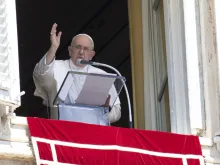 Pope Francis blesses the crowd from a window overlooking St. Peter's Square at the end of his Sunday Angelus address Aug. 13, 2023.