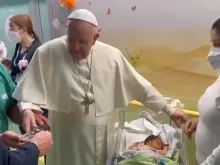 Pope Francis baptizes a baby at Gemelli Hospital in Rome on March 31, 2023.